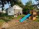 Backyard with a playset and a small deck at 1202 S Shipley St, Muncie, IN 47302