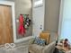 Inviting entryway with coat rack and comfortable seating at 1202 S Shipley St, Muncie, IN 47302