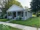 Gray house with white trim and a front porch at 1202 S Shipley St, Muncie, IN 47302