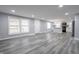 Open concept living room with gray walls and vinyl flooring at 1536 N Olive Church Rd, Paragon, IN 46166