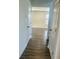 Hallway with wood-look flooring leading to various rooms at 6260 Card Blvd, Indianapolis, IN 46221