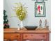 Wooden entry table with decorative bowl, vase, and figurines at 1936 Broadmoor Ln, Columbus, IN 47203