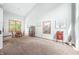 Bright dining room with vaulted ceiling, hardwood floors, and large windows at 1936 Broadmoor Ln, Columbus, IN 47203