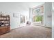 Large living room with hardwood floors and multiple windows at 1936 Broadmoor Ln, Columbus, IN 47203