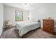 Cozy bedroom with double bed, dresser, and window at 1936 Broadmoor Ln, Columbus, IN 47203