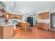 Updated kitchen features stainless steel appliances and wood cabinetry at 1936 Broadmoor Ln, Columbus, IN 47203