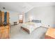 Primary bedroom with queen bed, TV, and access to bathroom at 1936 Broadmoor Ln, Columbus, IN 47203