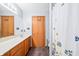 Neat bathroom with double vanity and tiled floor at 1936 Broadmoor Ln, Columbus, IN 47203