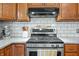 Stainless steel range and updated white backsplash at 1936 Broadmoor Ln, Columbus, IN 47203