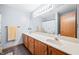 Bathroom with double vanity and tiled floor at 1936 Broadmoor Ln, Columbus, IN 47203