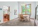 Dining room with view into kitchen and access to the backyard at 1936 Broadmoor Ln, Columbus, IN 47203