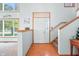 Bright entryway with hardwood floors, staircase and high ceilings at 1936 Broadmoor Ln, Columbus, IN 47203