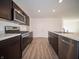 Kitchen features stainless steel appliances and wood cabinets at 6205 Card Blvd, Indianapolis, IN 46221