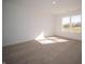 Spacious bedroom with large window and neutral carpeting at 6205 Card Blvd, Indianapolis, IN 46221
