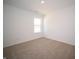 Bright bedroom featuring a large window and carpeted floors at 6205 Card Blvd, Indianapolis, IN 46221