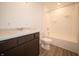 Clean bathroom with dark vanity and shower/tub combo at 6205 Card Blvd, Indianapolis, IN 46221