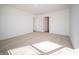 Bedroom with carpet, window, and access to another room at 6205 Card Blvd, Indianapolis, IN 46221