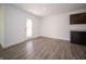 Bright bonus room with wood-look flooring and exterior access at 6205 Card Blvd, Indianapolis, IN 46221