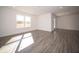 Spacious living room with large windows and wood-look floors at 6205 Card Blvd, Indianapolis, IN 46221