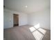 Bright bedroom with window and access to bathroom at 6205 Card Blvd, Indianapolis, IN 46221