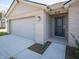 House exterior showcasing gray garage door and front entry at 6205 Card Blvd, Indianapolis, IN 46221