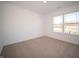 Spacious bedroom with neutral walls and carpeted floors at 6205 Card Blvd, Indianapolis, IN 46221