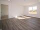 Bright living room with wood-look floors and access to other rooms at 6205 Card Blvd, Indianapolis, IN 46221