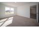 Spacious bedroom with large window and access to another room at 6205 Card Blvd, Indianapolis, IN 46221