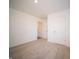 Spacious bedroom with neutral carpeting and ample closet space at 6205 Card Blvd, Indianapolis, IN 46221