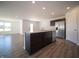 Open kitchen features an island and stainless steel appliances at 6205 Card Blvd, Indianapolis, IN 46221