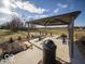 Relaxing covered picnic area with tables and a trash can at 6205 Card Blvd, Indianapolis, IN 46221