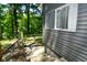 Side view of the house showcasing gray siding and lake views at 236 Lakeview W Dr, Nineveh, IN 46164