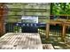 Outdoor deck with built-in gas grill and wooden table at 236 Lakeview W Dr, Nineveh, IN 46164