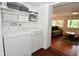 Clean laundry room includes washer, dryer, and upper cabinets at 236 Lakeview W Dr, Nineveh, IN 46164