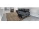 Living room with grey sectional sofa and jute rug at 1210 Finley Ave, Indianapolis, IN 46203