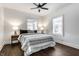 Bright bedroom with hardwood floors and a ceiling fan at 1210 Finley Ave, Indianapolis, IN 46203