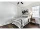 Bedroom with hardwood floors, ceiling fan, and window at 1210 Finley Ave, Indianapolis, IN 46203