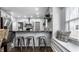 Kitchen boasts a breakfast bar with metal stools and a window seat at 1210 Finley Ave, Indianapolis, IN 46203