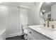 Modern bathroom with white subway tile, hexagon floor tile, and gold fixtures at 1210 Finley Ave, Indianapolis, IN 46203