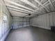 Spacious garage interior with high ceilings and overhead storage at 1210 Finley Ave, Indianapolis, IN 46203