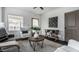 Bright living room with gray sectional and stylish decor at 1210 Finley Ave, Indianapolis, IN 46203