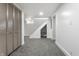 Finished basement with grey carpet, storage closet, and stairs at 1210 Finley Ave, Indianapolis, IN 46203