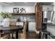 Modern kitchen with white cabinets, granite counters, and exposed brick at 1210 Finley Ave, Indianapolis, IN 46203