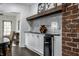 Sleek kitchen with white cabinets, granite counters and wine cooler at 1210 Finley Ave, Indianapolis, IN 46203