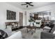 Open living room featuring stylish furniture and a view into the updated kitchen at 1210 Finley Ave, Indianapolis, IN 46203