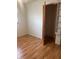 Bright bedroom with wood-look flooring and a spacious closet at 2416 Radcliffe Ave, Indianapolis, IN 46227