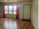 Living room with hardwood floors and large windows at 2416 Radcliffe Ave, Indianapolis, IN 46227