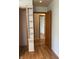Hallway with wood-look flooring and access to other rooms at 2416 Radcliffe Ave, Indianapolis, IN 46227
