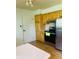 Bright kitchen features wood cabinets, stainless steel appliances, and wood flooring at 2416 Radcliffe Ave, Indianapolis, IN 46227