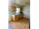 Kitchen with wood cabinets and laminate floors at 2416 Radcliffe Ave, Indianapolis, IN 46227